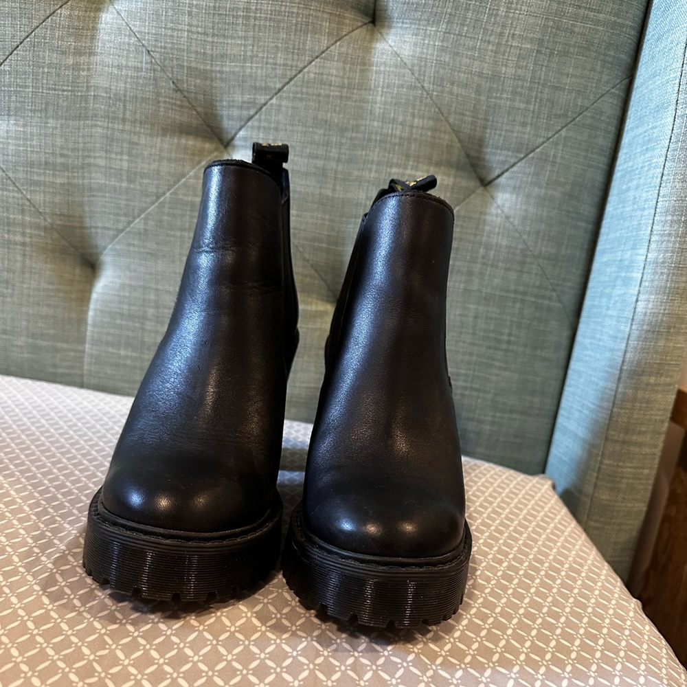 Dr. Martens heeled boots.